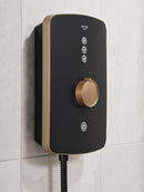 Triton shower mixer mounted on a tiled wall